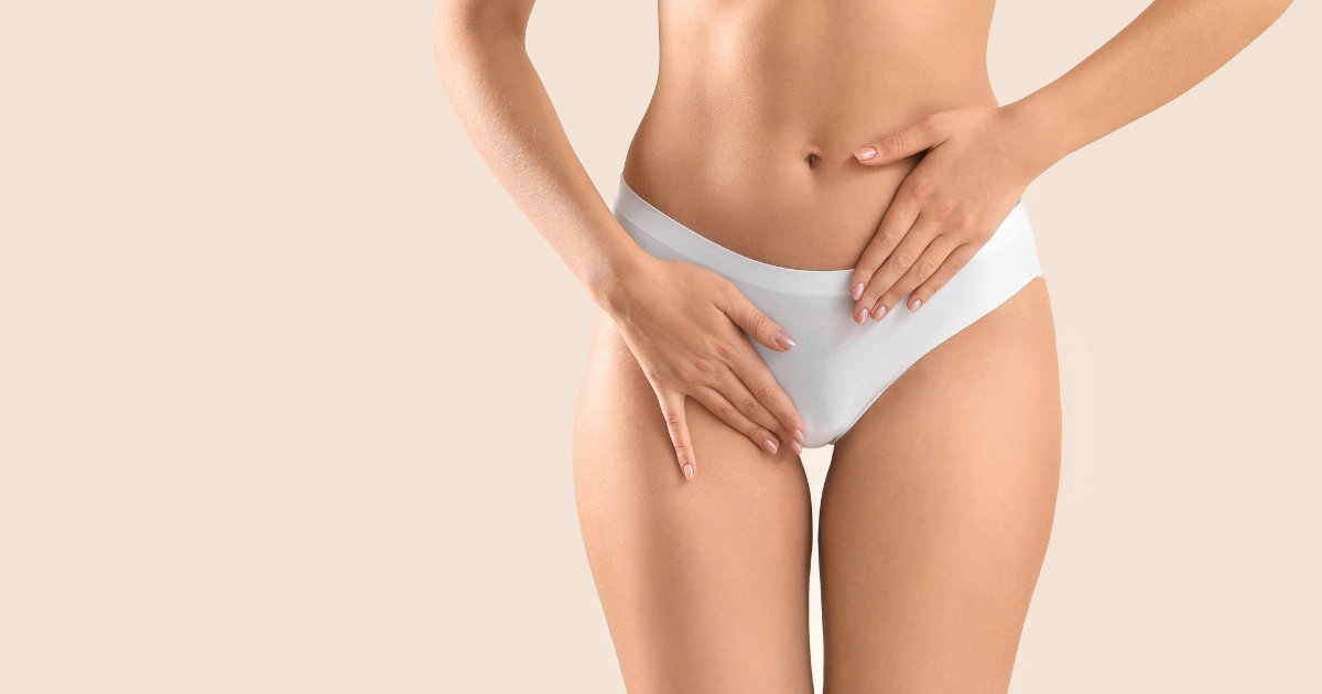 Woman highlighting pelvic area for pelvic floor treatment in Provo, UT