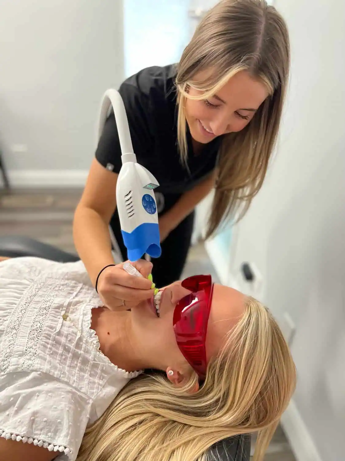 Client undergoing a professional teeth whitening treatment in Provo, Utah